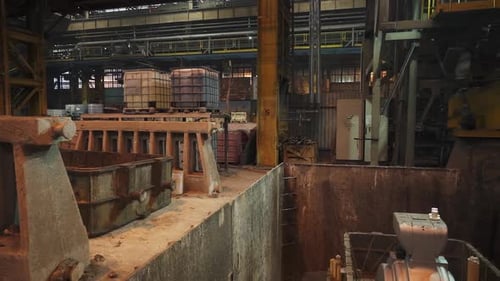 Industrial Crane Lifting Molten Metal in Foundry Stock Clip