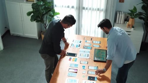 Top view of manager discussing with partner about UX UI design. Convocation.