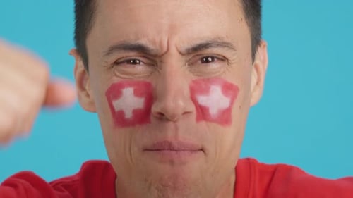 Close Up of a Man Supporting Swiss Team