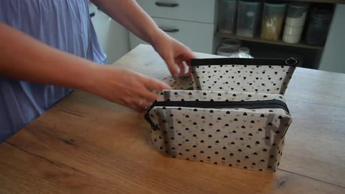 Woman Displaying Small Cosmetic Bags with Zipper