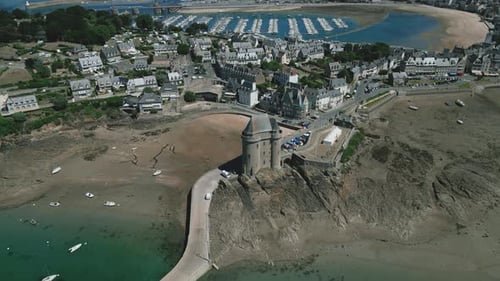Solidor tower with Saint-Malo city in background, Brittany in France. Aerial backward tilt-up reveal