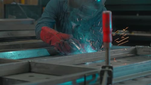 Welder at Work with Sparks Flying
