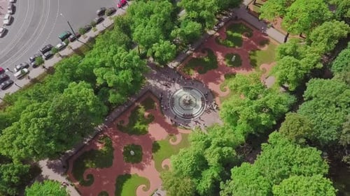 Summer Garden, an aerial drone fly by of a beautiful Koronniy (Crowning) fountain from top, people v