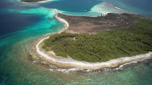 Crystal clear turquoise ocean water rippling under sunlight in a serene tropical location