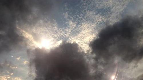 Majestic Clouds With Sun Peeking Through