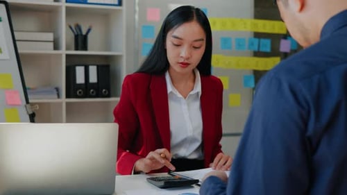 Business Meeting with Financial Planning in Modern Office