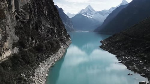 Lake Paron, Pyramid Mountain, Aerial Drone Above Water Andean Cordillera in Peru Huascaran National