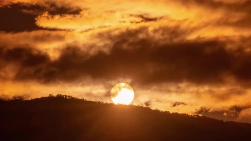 Golden Sunrise Time-Lapse over Mountain Silhouette