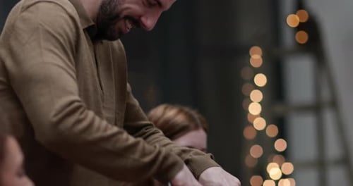 Close-up adult male serving Christmas meal to friends