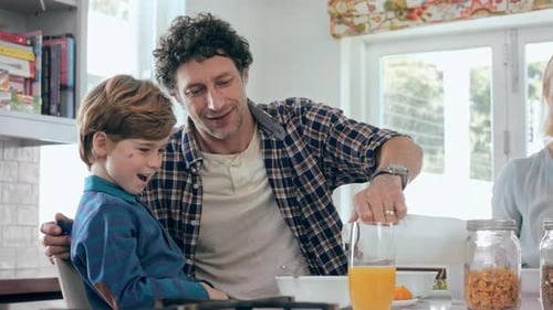 Father and Son Enjoying Breakfast Together at Home