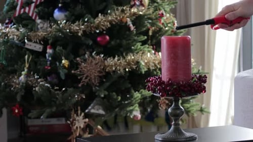 Lighting a Christmas candle
