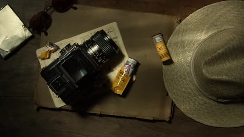 Top View of an Outdated Analogue Photography Device a and Straw Hat