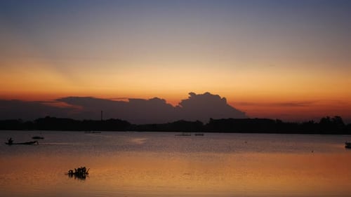 Still Lake Reflects Beautiful Golden Sunset