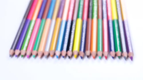 Multicolored Pencils Stacked in a Row Closeup on a White Background the Concept of Creativity