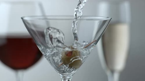 Pouring a Martini with Olive and Other Cocktails