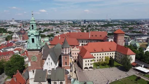 Flyover of the Wawel Royal Castle Cathedral on the Vistula (Wisła) River - Krakow, Poland, a Polish