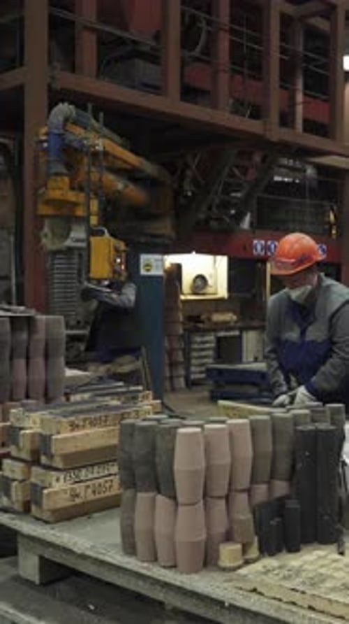 Foundry Workers Preparing Molds for Metal Casting Stock Clip