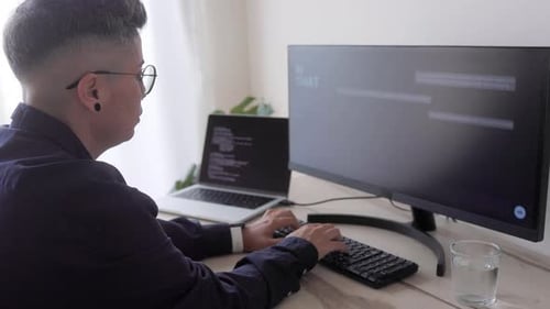 AI chatbot: Programmer using artificial intelligence for software development inside office