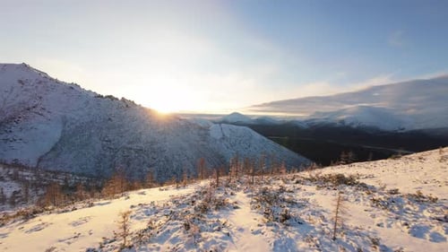 Snowy Mountains at Sunrise or Sunset from Above