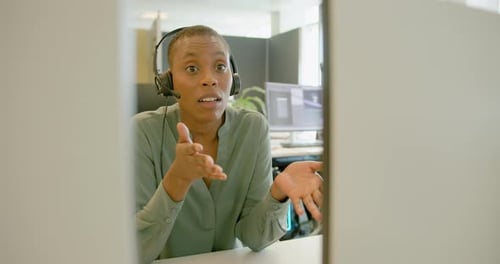 Businessperson with Headset on a Video call in an Office, Telemarketing, Call centre