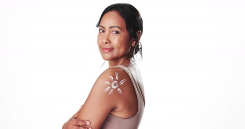 Face, skincare and sunscreen with happy woman in studio for spf or uv protection and skin health