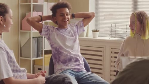 Happy Teen Boy at Group Therapy Session