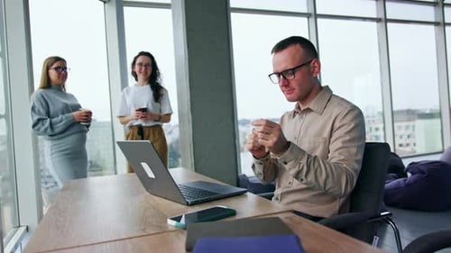 Office Workers Taking Break in a Modern Workplace