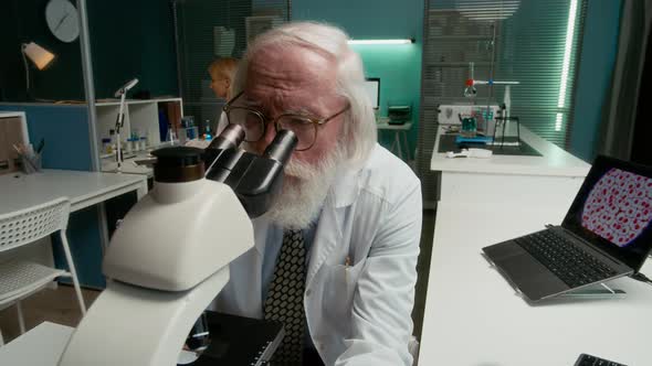 Female Colleague Bringing Research Journal to Senior Male Scientist in ...