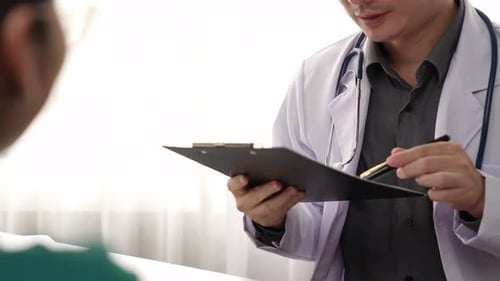 Patient attend doctor's appointment at clinic or hospital office. Rigid.