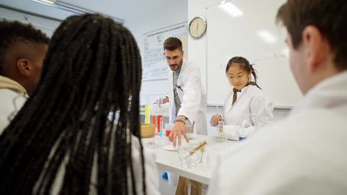 Instructor Teaching Chemistry to Diverse Students in Lab
