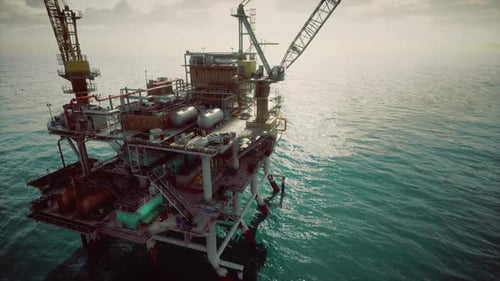 Closeup of Industrial Oil Rig Deck with Safety Signs and Bright Lighting