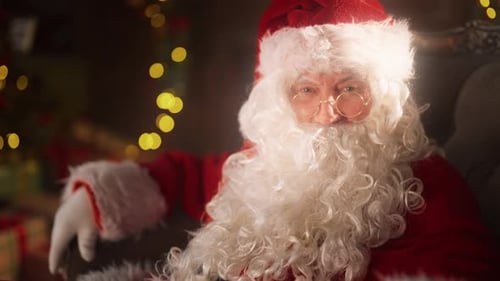 Santa Claus Relaxing in an Armchair by Christmas Tree