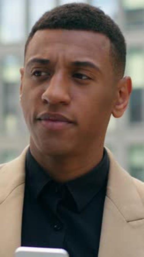 Smiling African American Business Man Chatting Smartphone in City Street Male Entrepreneur Using