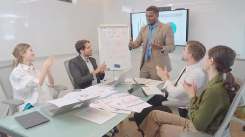 Colleagues Applauding Successful Business Presentation
