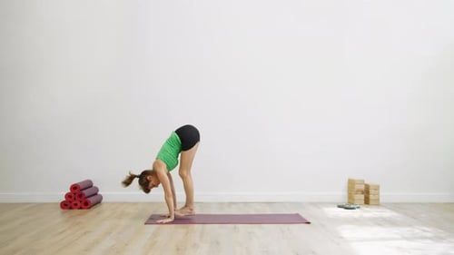 Woman in graceful relaxation posture in green garden