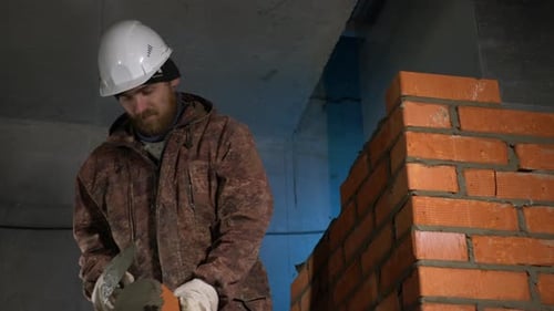 Construction Worker Building Brick Wall Indoors
