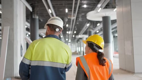 Construction Workers Indoors Two Engineers Man Woman Building Construction Site Drawing Blueprint