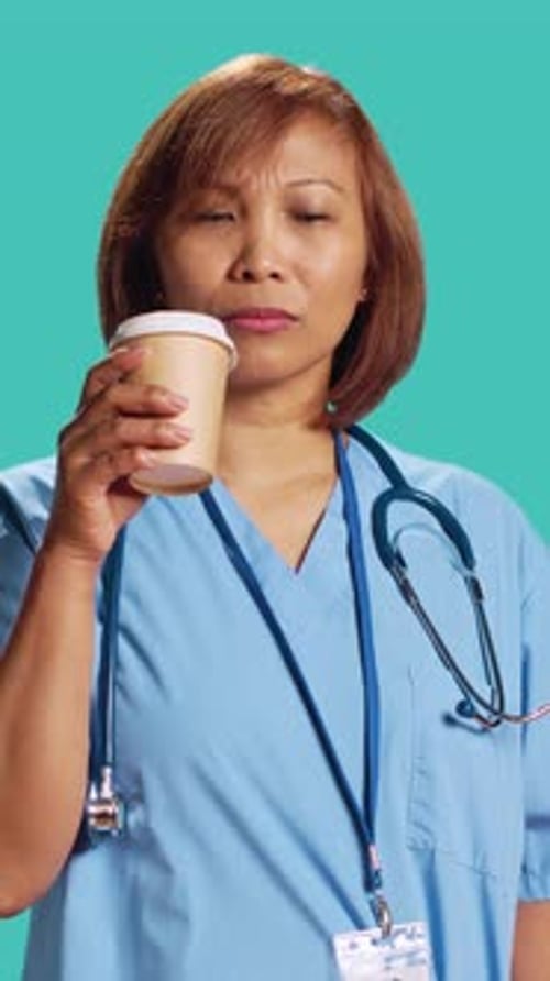 Nurse Tasting Instant Coffee at Work