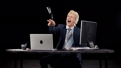 Angry Office Worker Screams And Tosses Pens On Desk