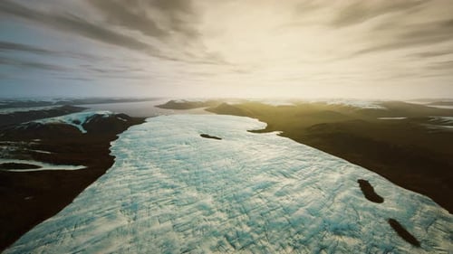 Aerial Flyover of a Massive Glacier in a Mountainous Landscape