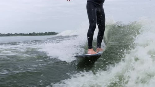 Man wake surfing on a wave