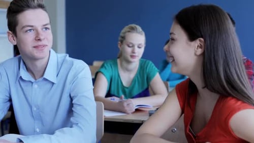 Teen Students Talking in Classroom at School