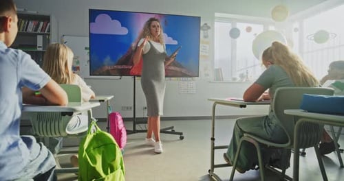 Teacher Explains Volcano to Children in Classroom
