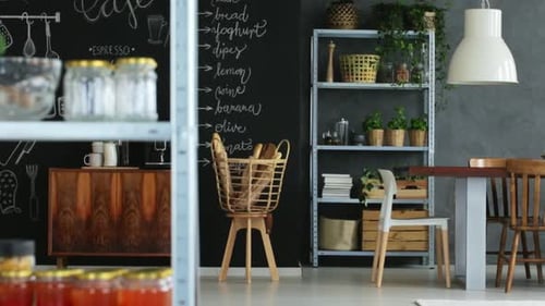 Bright dining room with chalkboard wall and accessories