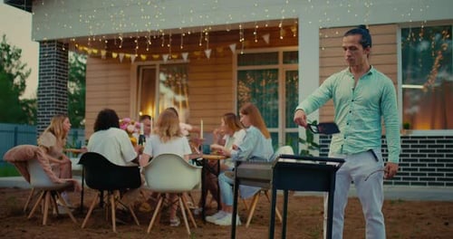 Friends Enjoying a Backyard Barbecue Together