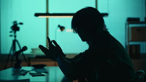 Tense Interrogation in Shadowy Office Setting