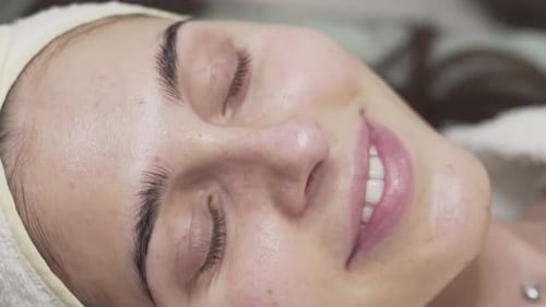 Close up scene of a beautiful woman relaxing at the spa