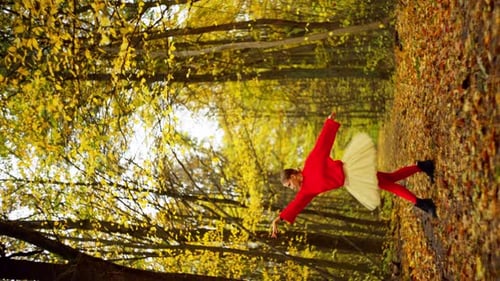Ballerina Dancing in Autumn Forest, Wearing Red