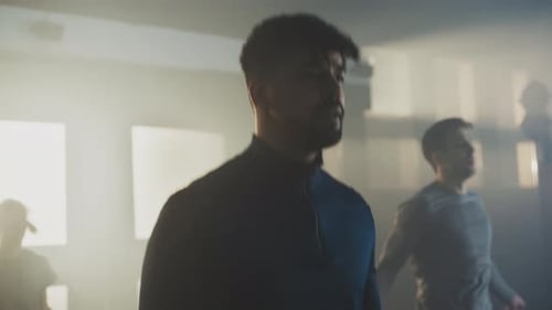 Athletic Men Working Out at the Gym