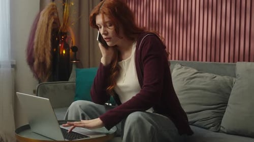 Woman Working from Home on Laptop